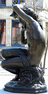 Carpeaux's Girl with Shell - bronze draped outdoors, left