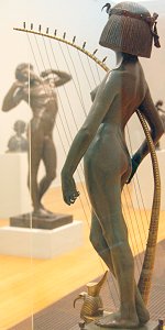 The Singer by Edward Onslow Ford - back left (and The Sluggard by Alfred, Lord Leighton - front right)