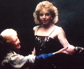 Mrs Benjamin shows Brenda how to pose