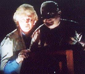 Mr and Mrs Benjamin watch Brenda posing