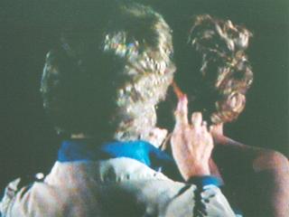 Mrs Benjamin combing Brenda's hair